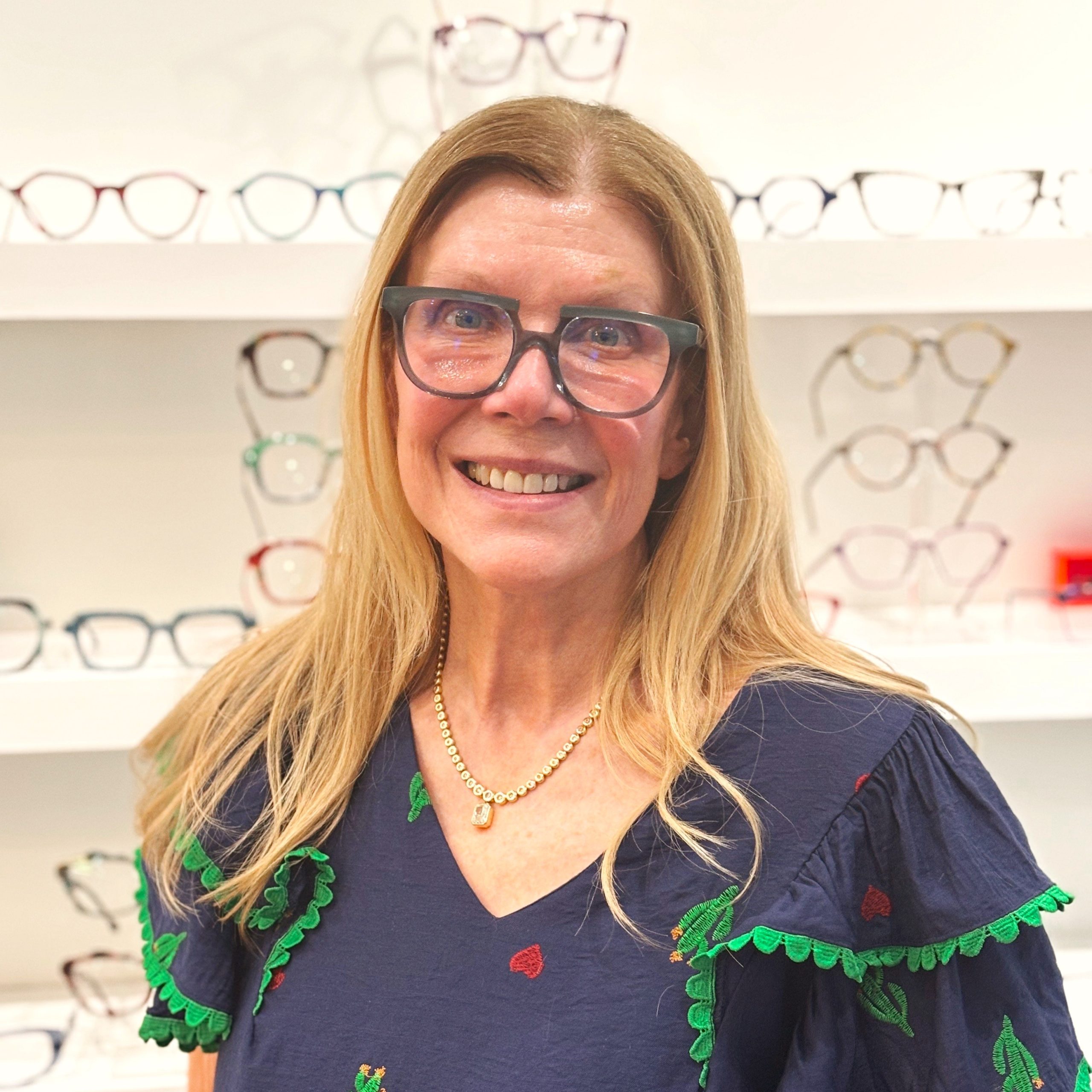 Bright Side client in expressive blue eyeglasses