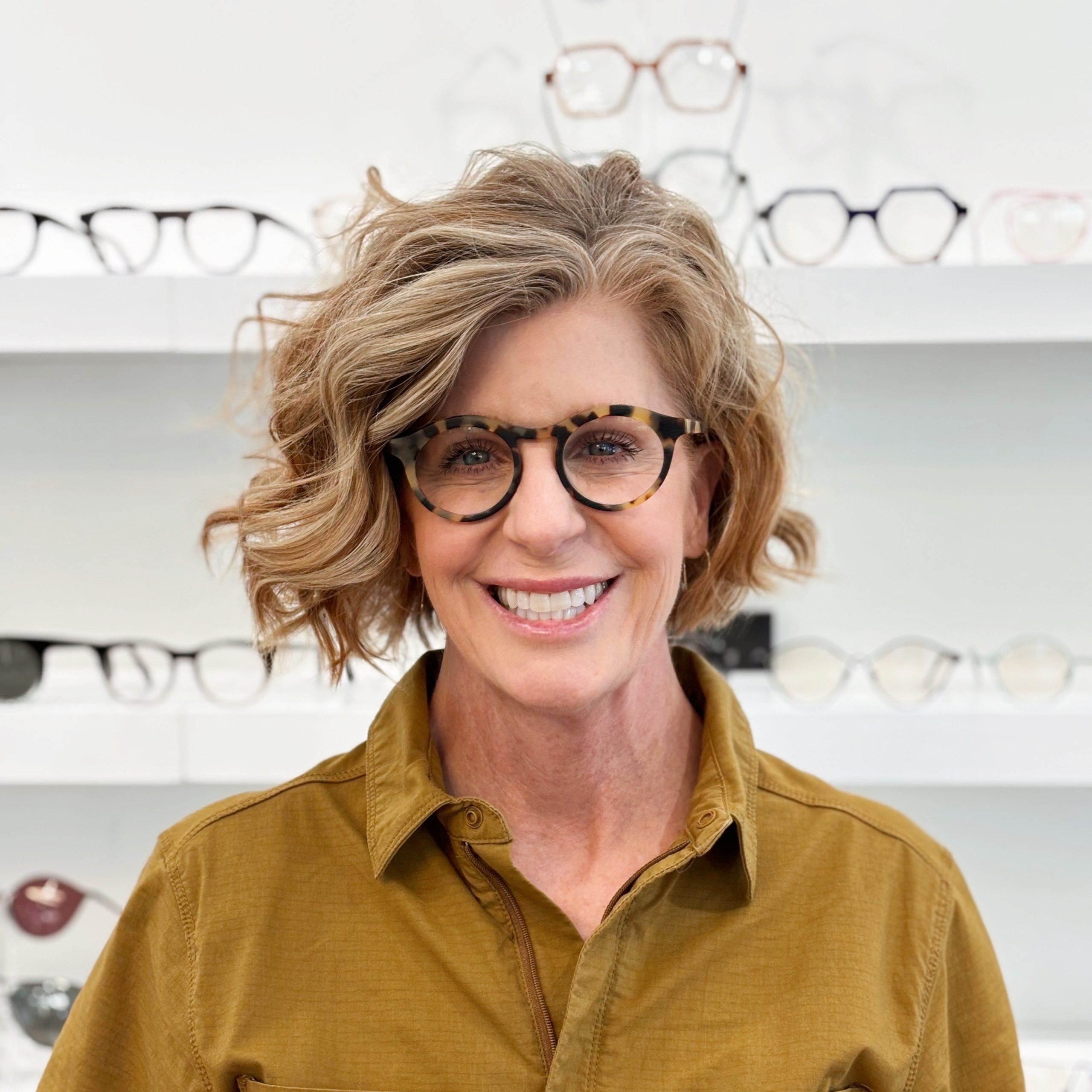 Bright Side client smiling in statement eyeglasses