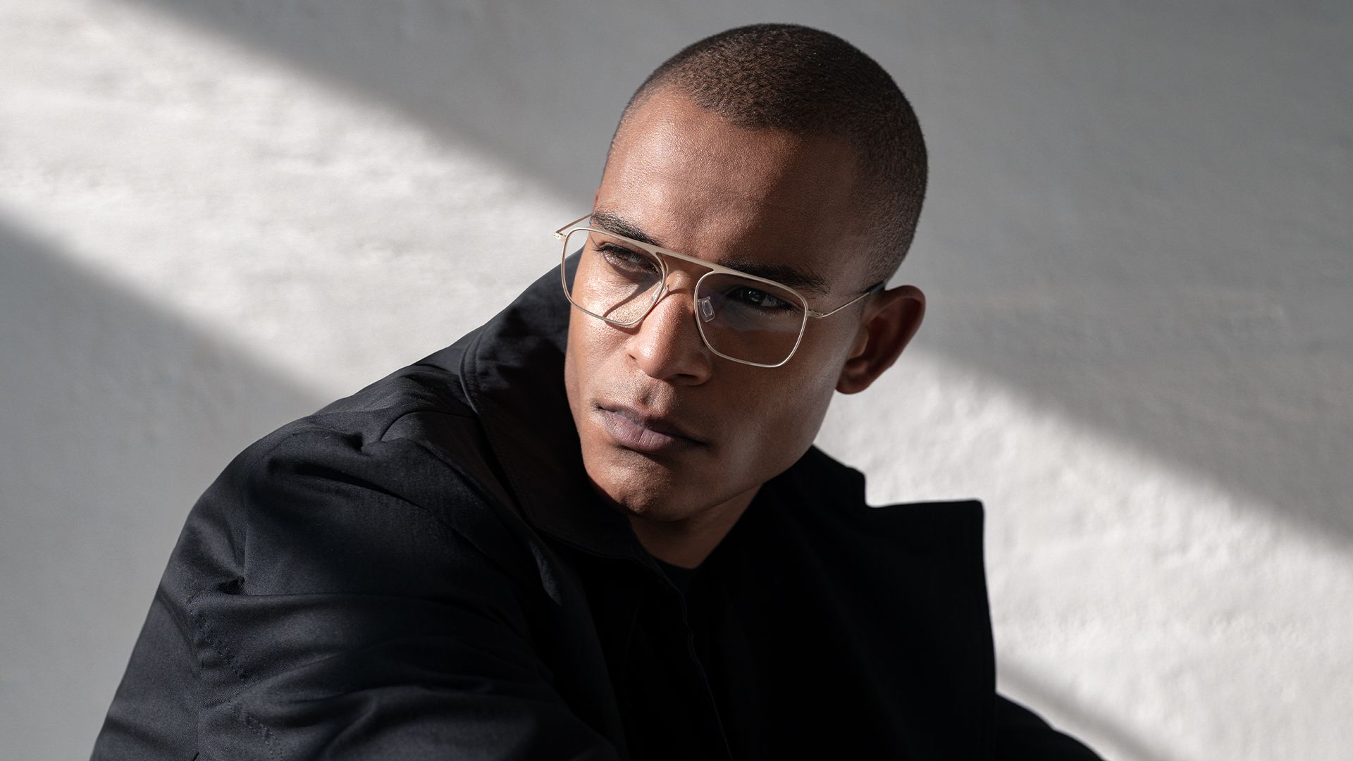 Model wearing refined Blackfin titanium eyeglasses
